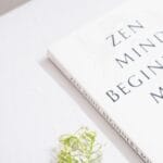 Photo by Sehajpal Singh a book with a flower on top of it